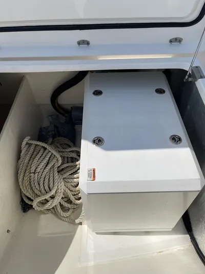 Seventeen Yacht Photos Pics Storage compartment on a 2020 Leopard 50 boat with coiled rope.