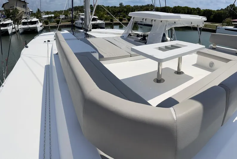 Seventeen Yacht Photos Pics Leopard 50 yacht 2020 model, spacious deck with seating and table, docked at marina.