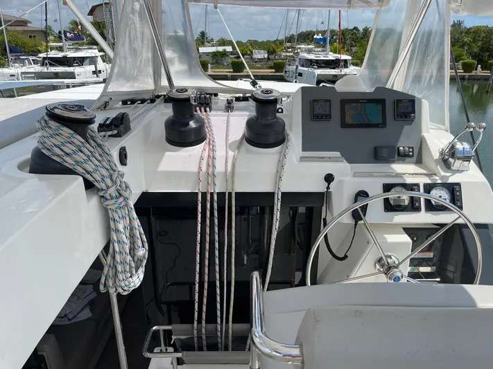 Seventeen Yacht Photos Pics Leopard 50 yacht cockpit with navigation equipment and ropes, docked in a marina, 2020 model.