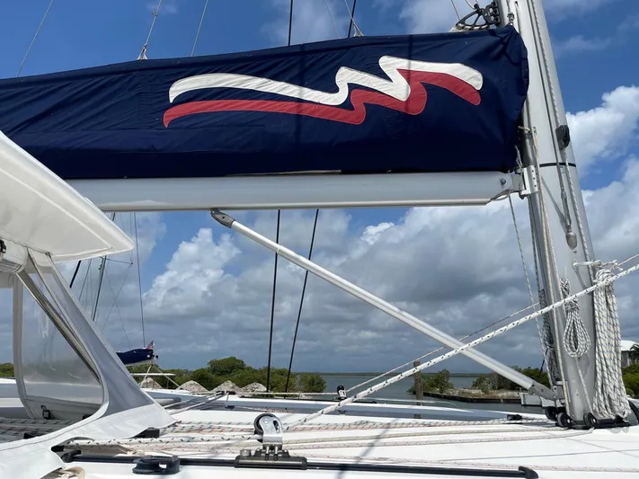 Seventeen Yacht Photos Pics Leopard 50 sailboat, 2020 model, with blue sail cover and scenic ocean backdrop.