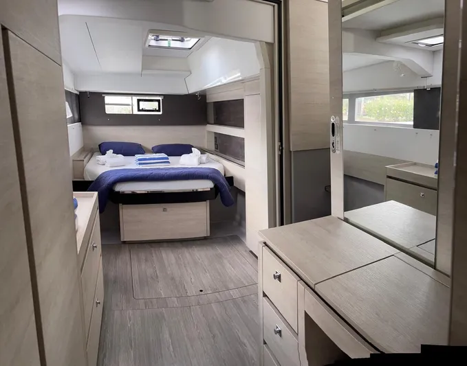 Seventeen Yacht Photos Pics Modern interior of a 2020 Leopard 50 yacht with a cozy bedroom.