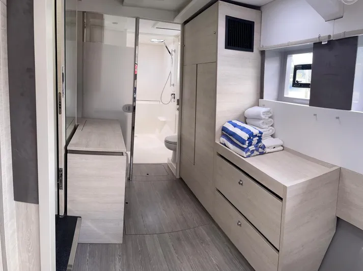 Seventeen Yacht Photos Pics Modern interior of Leopard 50 yacht, 2020 model, featuring bathroom and storage area.