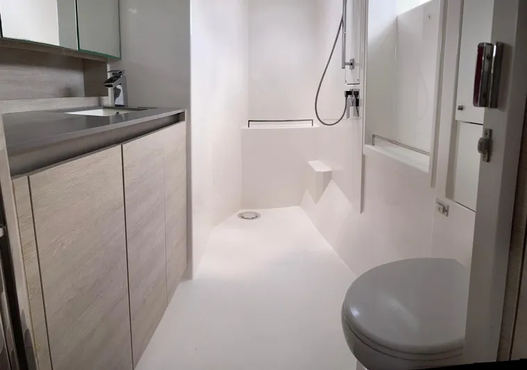 Seventeen Yacht Photos Pics Modern bathroom in a 2020 Leopard 50 yacht with sleek fixtures and minimalist design.