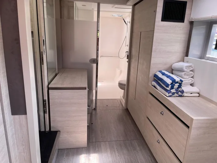 Seventeen Yacht Photos Pics Modern bathroom interior of 2020 Leopard 50 yacht with shower and storage.