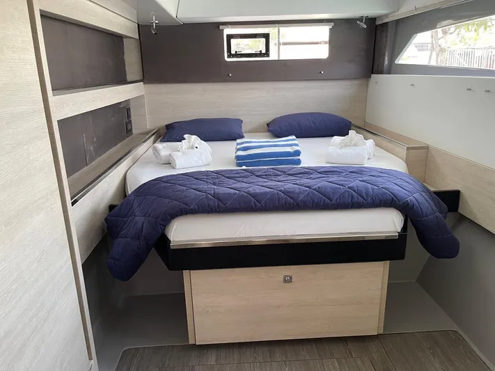 Seventeen Yacht Photos Pics Leopard 50 yacht bedroom, 2020 model, with cozy bed and blue bedding.