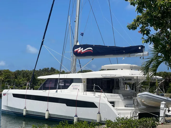 Seventeen Yacht Photos Pics 2020 Leopard 50 catamaran docked in a tropical marina.