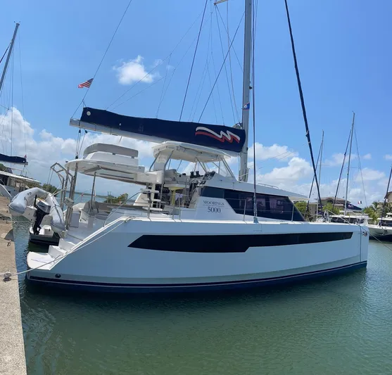 Seventeen Yacht Photos Pics 2020 Leopard 50 catamaran docked at marina under clear blue sky.