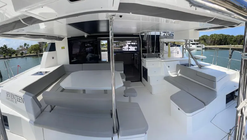 Seventeen Yacht Photos Pics Leopard 50 catamaran 2020 model, spacious outdoor seating and dining area with modern design.