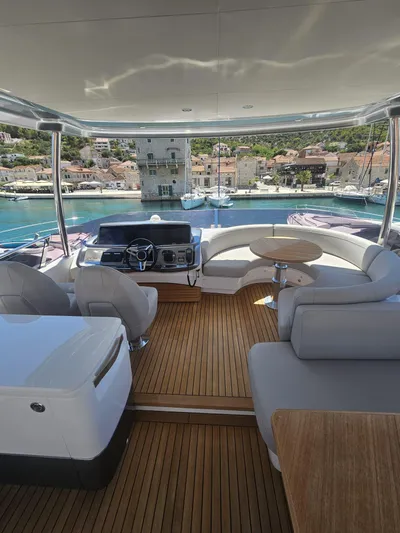  Yacht Photos Pics Luxurious 2020 Princess F62 yacht interior with elegant seating and scenic harbor view.