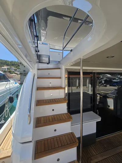  Yacht Photos Pics Staircase on 2020 Princess F62 yacht with teak steps and sleek design.