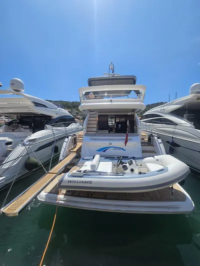  Yacht Photos Pics Luxury 2020 Princess F62 yacht docked with inflatable boat on deck.
