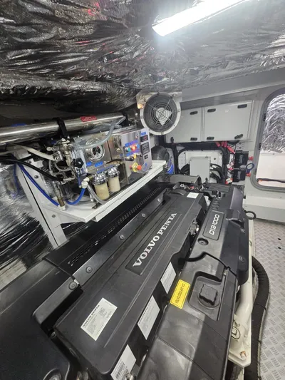  Yacht Photos Pics Engine room of a 2020 Princess F62 yacht featuring a Volvo Penta engine.