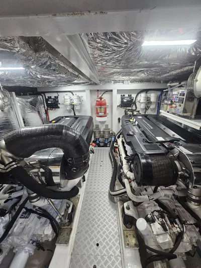  Yacht Photos Pics Engine room of a 2020 Princess F62 yacht, featuring dual engines and advanced equipment.