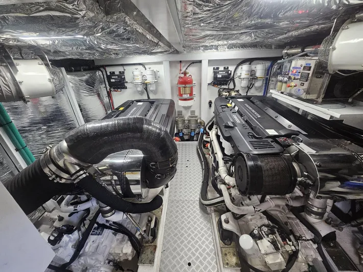  Yacht Photos Pics Engine room of a 2020 Princess F62 yacht, featuring advanced machinery and equipment.