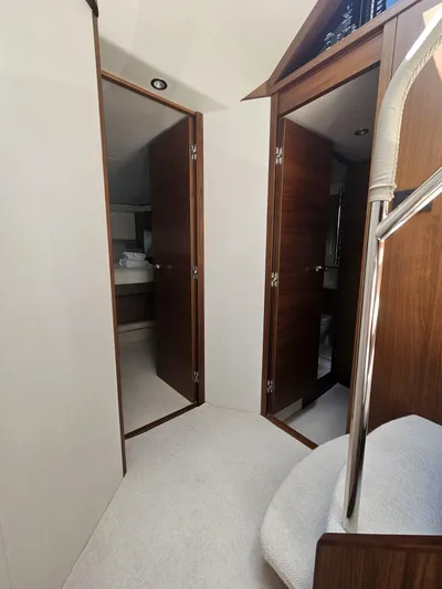  Yacht Photos Pics Interior of 2020 Princess F62 yacht with wooden doors and modern design.