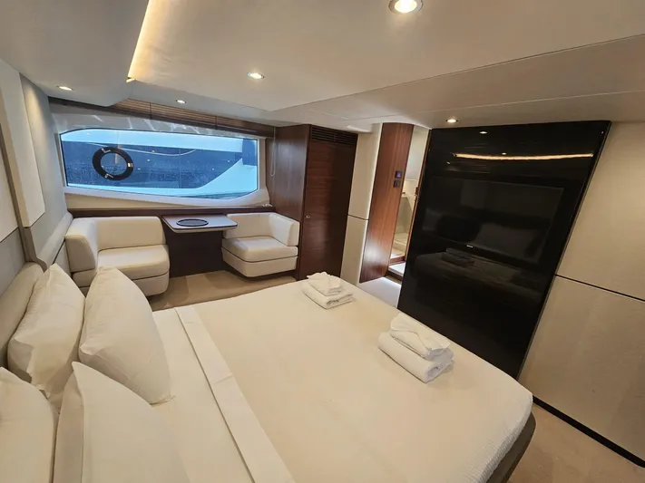  Yacht Photos Pics Luxurious 2020 Princess F62 yacht bedroom with modern decor and large window view.