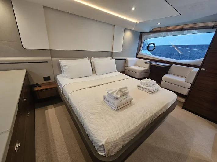  Yacht Photos Pics Luxurious 2020 Princess F62 yacht bedroom with elegant decor and large window view.