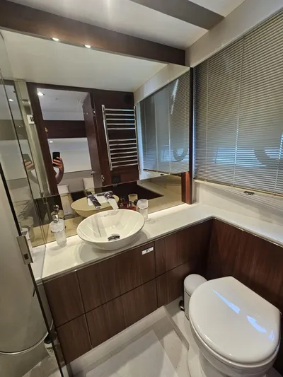  Yacht Photos Pics Luxurious bathroom in 2020 Princess F62 yacht with modern fixtures and elegant design.