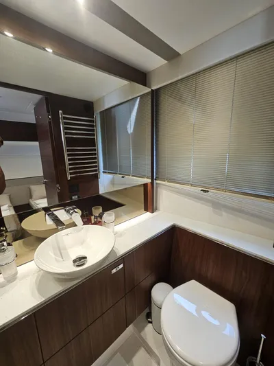  Yacht Photos Pics Luxurious bathroom in 2020 Princess F62 yacht with modern fixtures and elegant design.