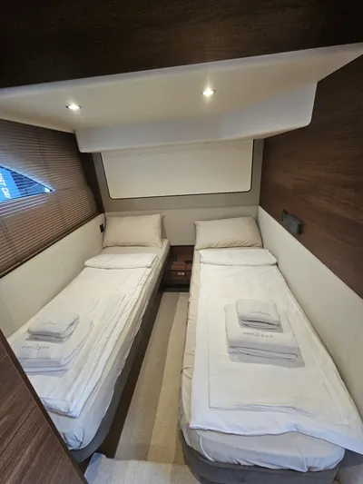  Yacht Photos Pics Luxurious twin cabin in 2020 Princess F62 yacht with modern decor and cozy bedding.