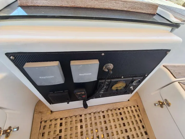 Taita I Yacht Photos Pics Control panel of a 2001 Comet 54 DH boat with navigation equipment.