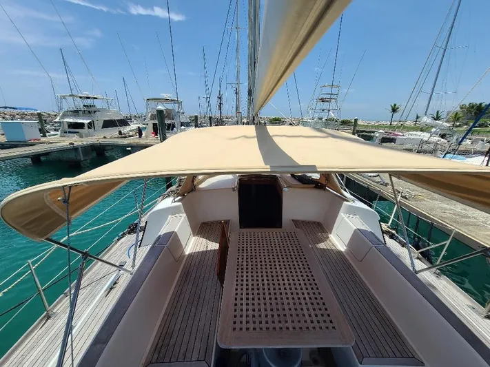 Taita I Yacht Photos Pics Sailboat Comet 54 DH, 2001 model, docked at marina under clear blue sky.