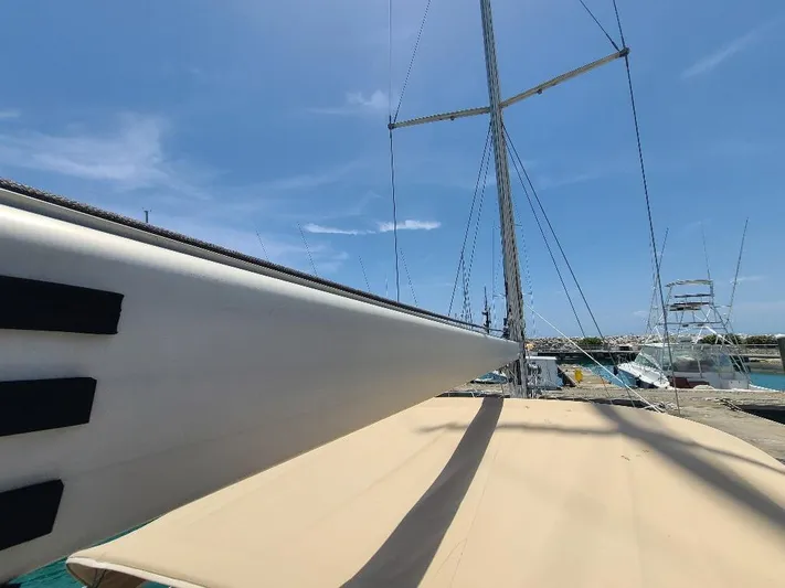 Taita I Yacht Photos Pics Sailboat deck view under clear sky, Comet 54 DH, 2001 model.