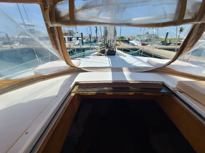 Taita I Yacht Photos Pics 2001 Comet 54 DH sailboat cockpit view at marina, showcasing deck and clear canopy.