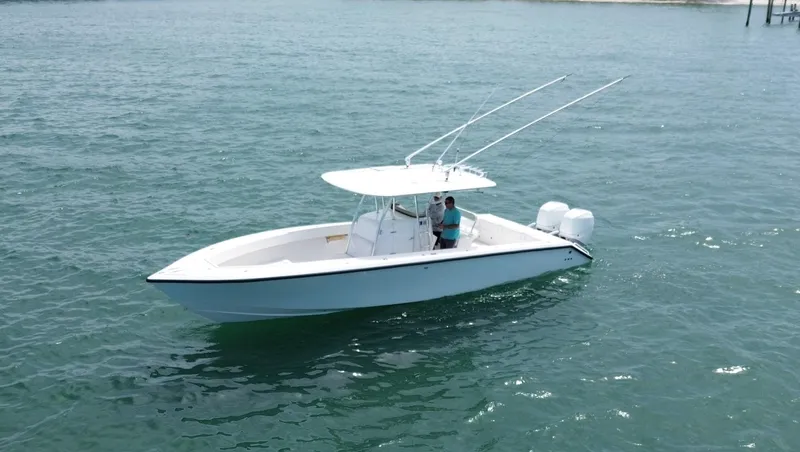 Reel Lucky Yacht Photos Pics 2006 Venture 34 Open boat on calm ocean waters.