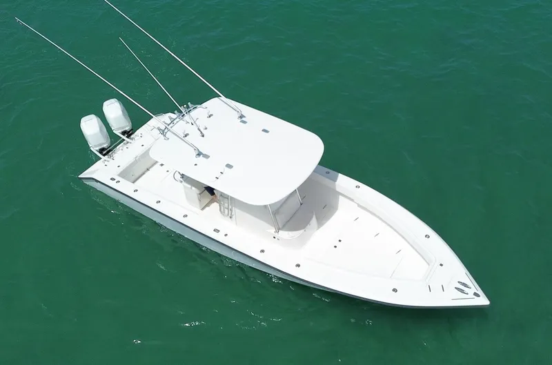 Reel Lucky Yacht Photos Pics 2006 Venture 34 Open boat with dual engines on clear water.