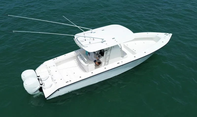 Reel Lucky Yacht Photos Pics 2006 Venture 34 Open boat with dual engines on calm water.