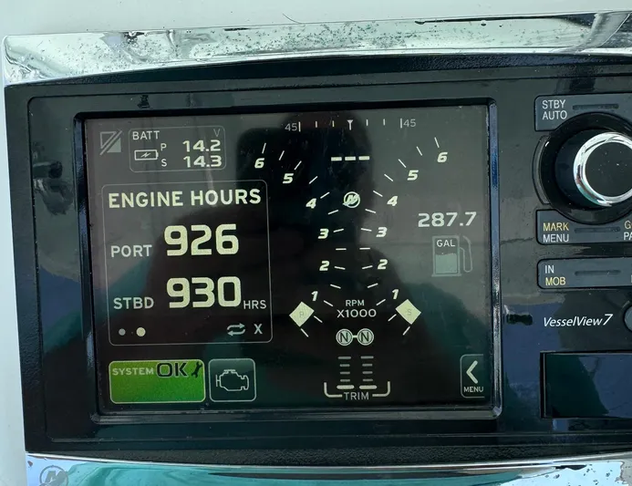 Reel Lucky Yacht Photos Pics Boat dashboard display showing engine hours and battery voltage on a 2006 Venture 34 Open.