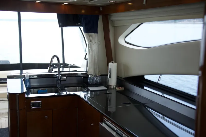  Yacht Photos Pics Interior of 2012 Meridian 541 Sedan yacht kitchen with sleek countertops and modern fixtures.