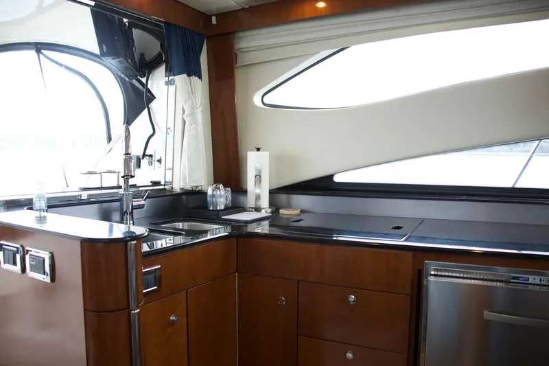  Yacht Photos Pics Luxurious kitchen interior of 2012 Meridian 541 Sedan yacht with modern amenities.