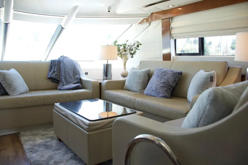  Yacht Photos Pics Luxurious interior of a 2012 Meridian 541 Sedan yacht with plush seating and elegant decor.