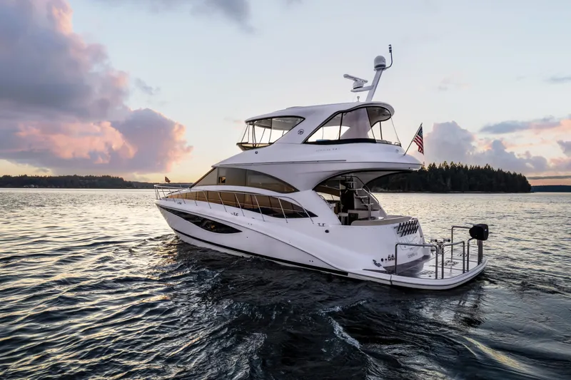  Yacht Photos Pics Luxurious 2012 Meridian 541 Sedan yacht cruising at sunset on serene waters.