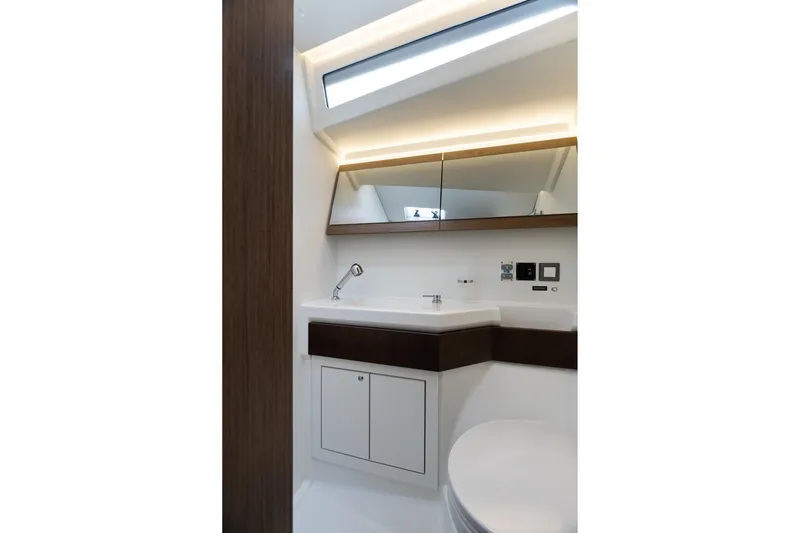  Yacht Photos Pics Modern bathroom interior of 2020 Beneteau Oceanis 46.1 yacht, featuring sleek design and lighting.