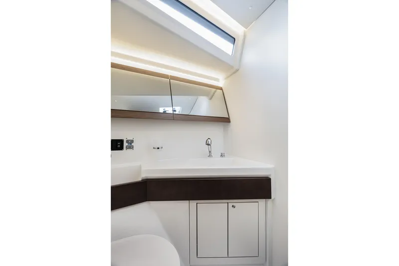  Yacht Photos Pics Modern bathroom interior on 2020 Beneteau Oceanis 46.1 yacht, featuring sleek design and lighting.