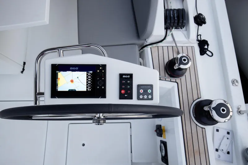  Yacht Photos Pics Steering console of 2020 Beneteau Oceanis 46.1 yacht with navigation display and controls.