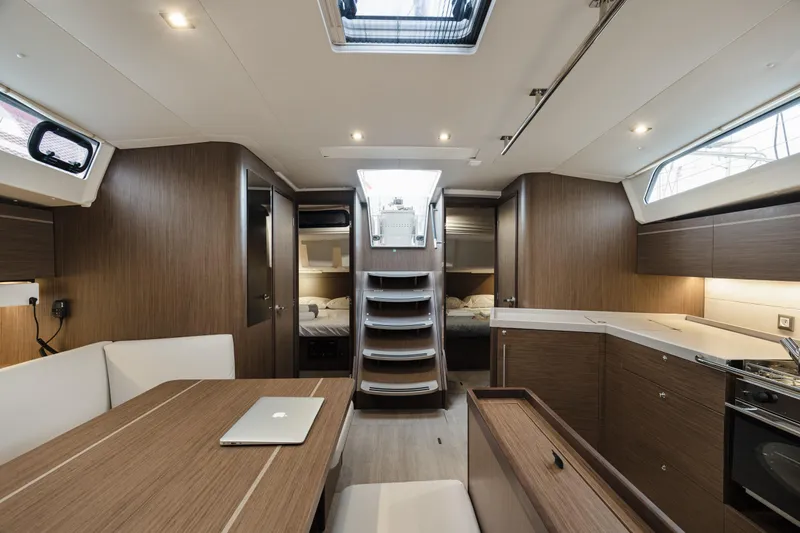  Yacht Photos Pics Interior of 2020 Beneteau Oceanis 46.1 yacht, featuring modern wood finish and spacious layout.