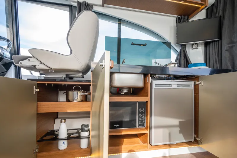  Yacht Photos Pics Interior of 2025 Beneteau Antares 11 Fly, featuring modern kitchen amenities.