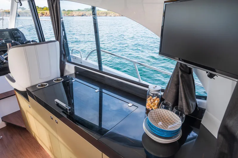  Yacht Photos Pics Interior of 2025 Beneteau Antares 11 Fly yacht with modern amenities and ocean view.