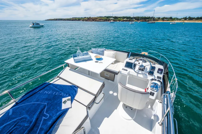  Yacht Photos Pics 2025 Beneteau Antares 11 Fly yacht with luxurious deck and ocean view.