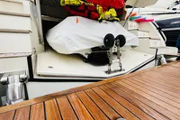 Astondoa Open 53 yacht, 2008 model, featuring a wooden deck and storage compartment.