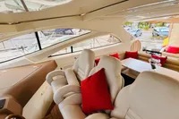 Luxurious interior of 2008 Astondoa Open 53 yacht with plush seating and red accents.