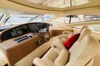 Luxurious 2008 Astondoa Open 53 yacht interior with plush seating and modern dashboard.