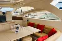 Luxurious interior of 2008 Astondoa Open 53 yacht with elegant seating and dining area.