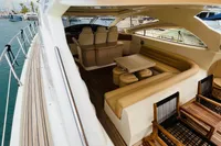 Luxurious 2008 Astondoa Open 53 yacht interior with elegant seating and dining area.