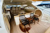 Luxurious 2008 Astondoa Open 53 yacht interior with elegant seating and wooden deck.