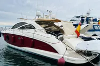 Astondoa Open 53 yacht, 2008 model, docked in a marina with flags displayed.
